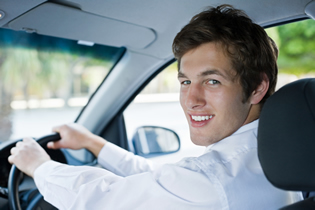 young man behind the wheel